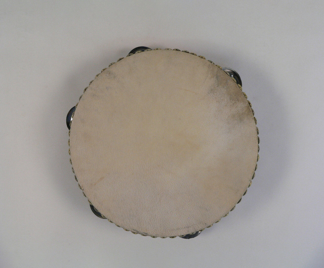 Top view of a tambourine, showing five sets of cymbals around the side. - click to view larger image