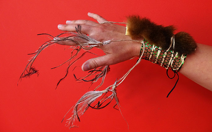 A bracelet made with fur and feathers.