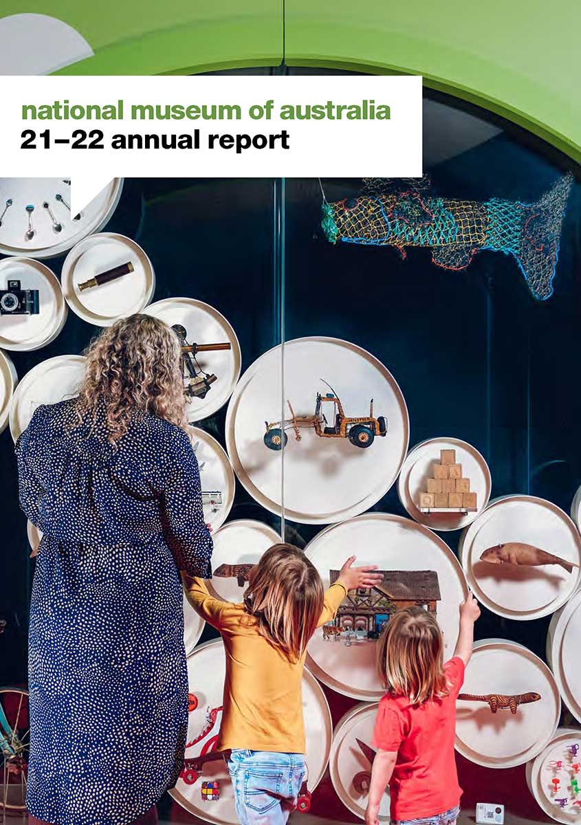 Cover of the National Museum of Australia 2021 to 2022 Annual Report. The cover features a photo of a woman and two children looking at a display cabinet containing various objects.