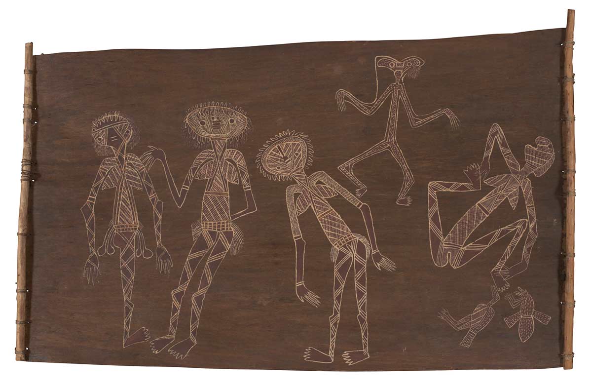 A bark painting worked in ochres and on wooden restrainers. It depicts a male spirit figure in the background who is painted in pipeclay and infilled with dashes. In the foreground there are four female figures outlined in pipeclay and infilled with crosshatching. - click to view larger image