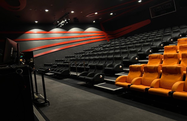 Photograph of the Museum's Visions Theatre. The theatre is large with chairs similar to a cinema layout. 