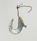 Fishhook made of mother-of-pearl, where strings made of various plant fibres are attached.