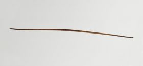 Bow made of wood slightly and unevenly bent, being narrower in the middle, and ends.
