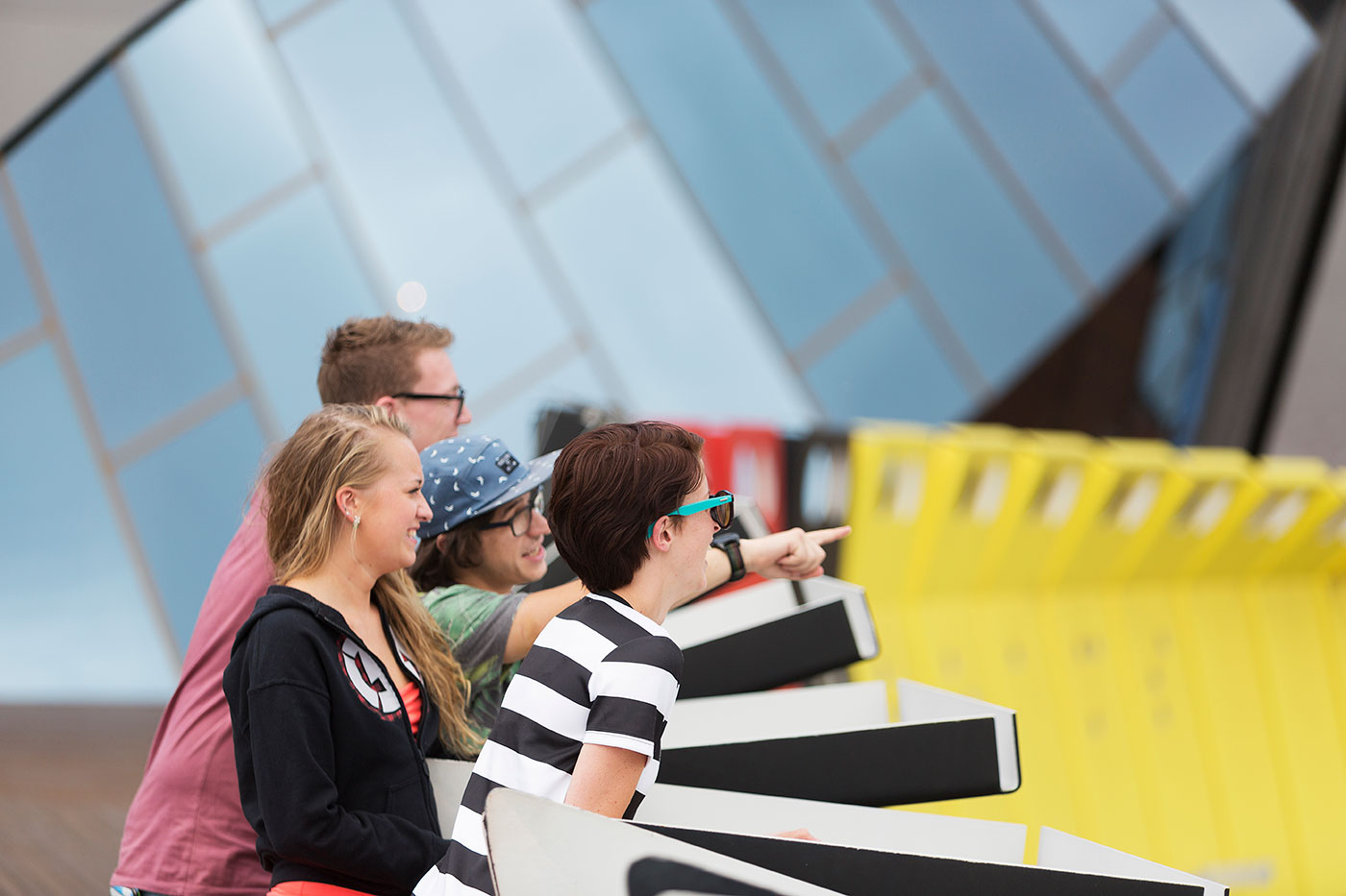 Group of people observing their surroundings of colourful architecture.