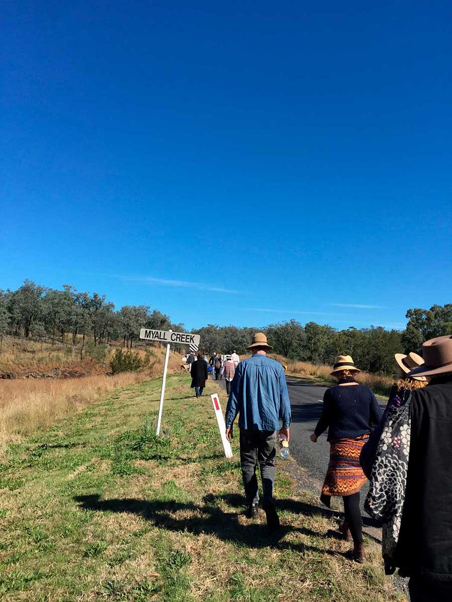 Participants walking to the Myall Memorial site in June 2015. - click to view larger image