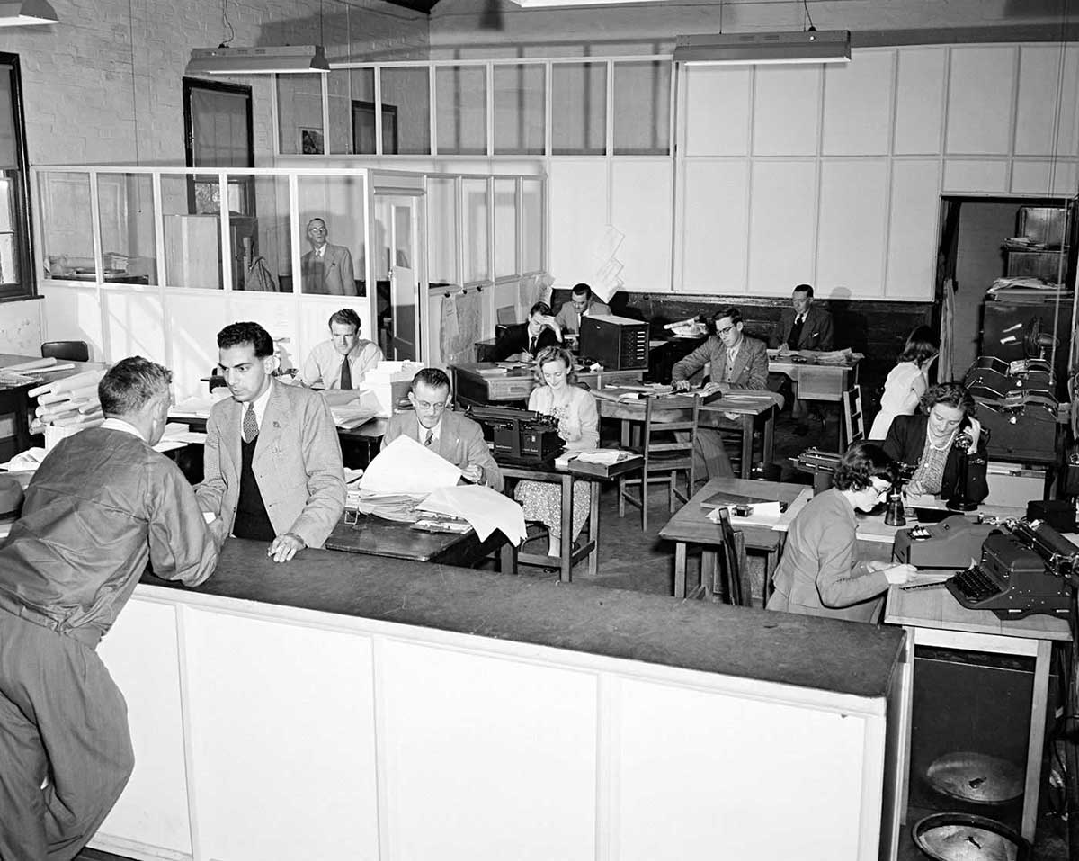 Photo of workers at the Cooma office of the Snowy Hydro scheme. - click to view larger image