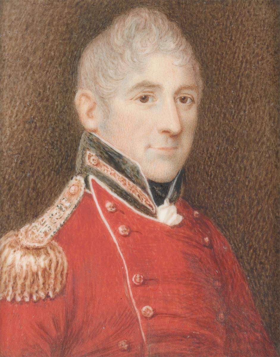 Three-quarter profile portrait painting of smiling middle-aged man with grey, curly hair wearing the dress uniform of a senior army officer – red tunic with black collar and gold epaulettes. - click to view larger image