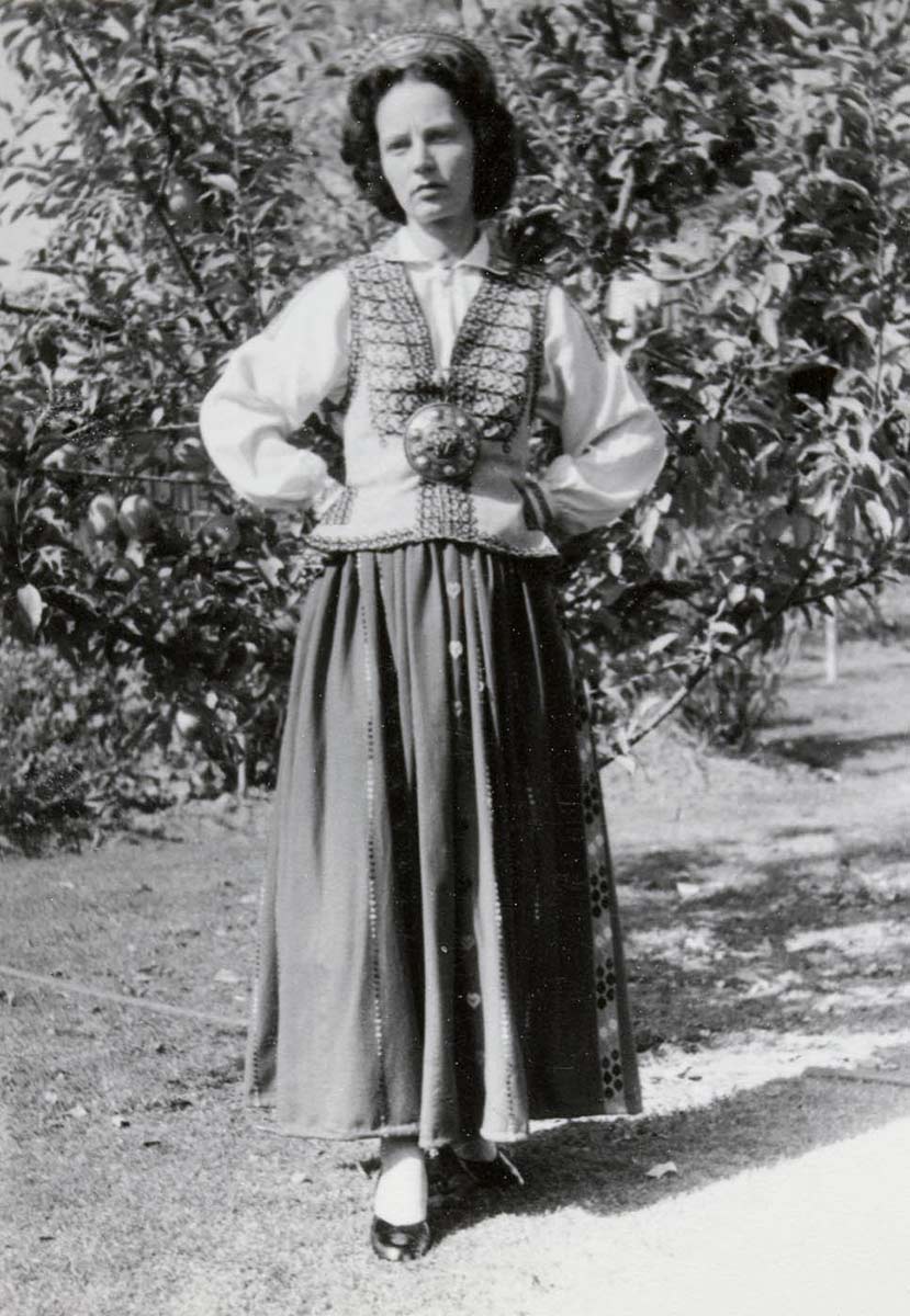 Black and white photograph of a woman wearing national Latvian clothing. - click to view larger image