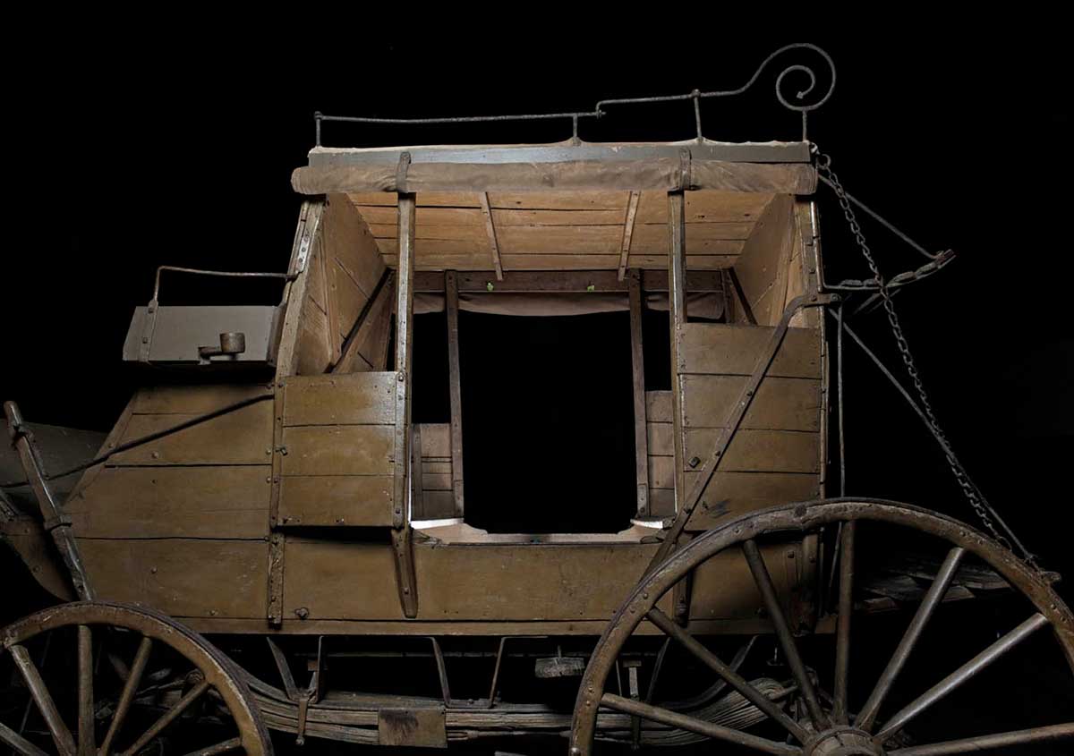 Wooden mail coach, painted brown. - click to view larger image