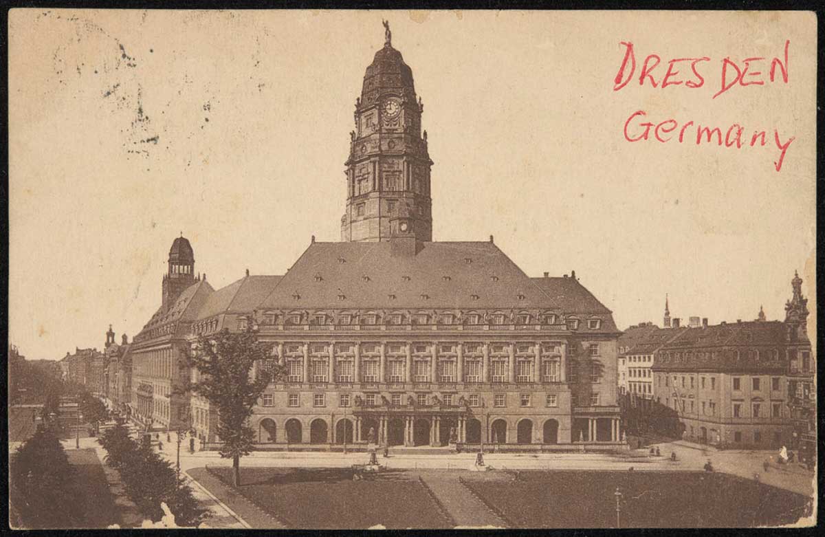 Postcard showing a large ornate city building. - click to view larger image