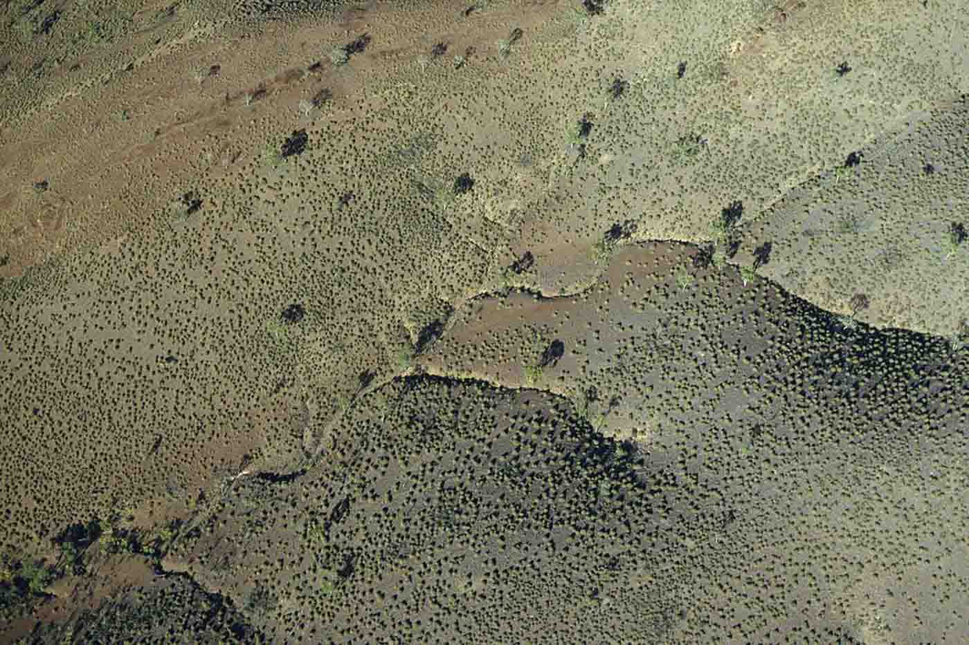 Aerial view of a landscape with foothills. - click to view larger image