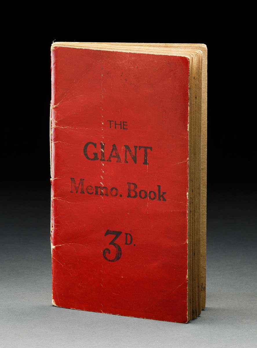 A red cardboard covered diary. The cover reads 'THE GIANT Memo. Book 3D.' - click to view larger image