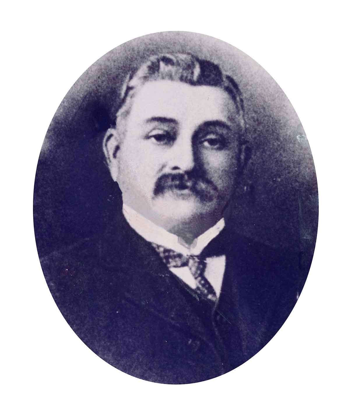 Black and white photo portrait of a man with a moustache. - click to view larger image