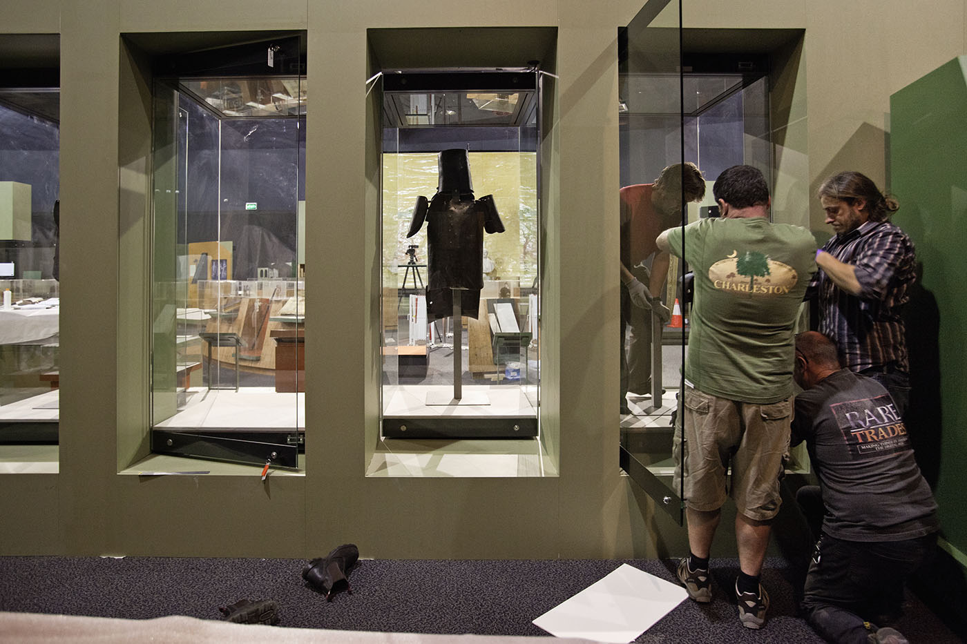 Staff working on installing armoury for an exhibition. - click to view larger image