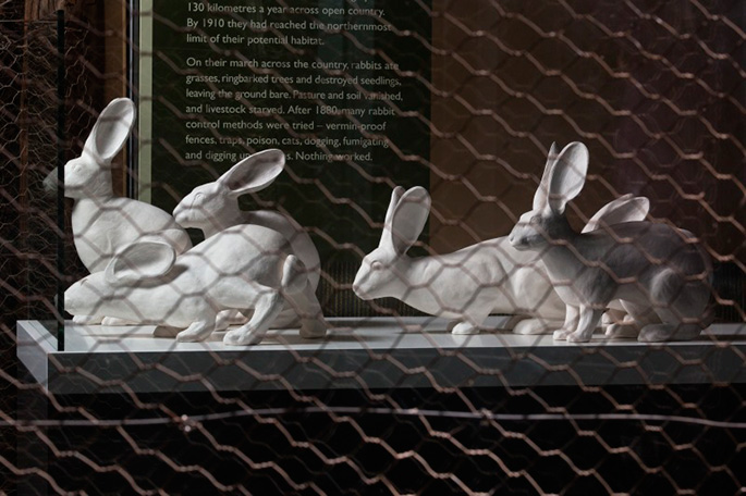 Six matt white ceramic figures modelled on the European wild rabbit. - click to view larger image