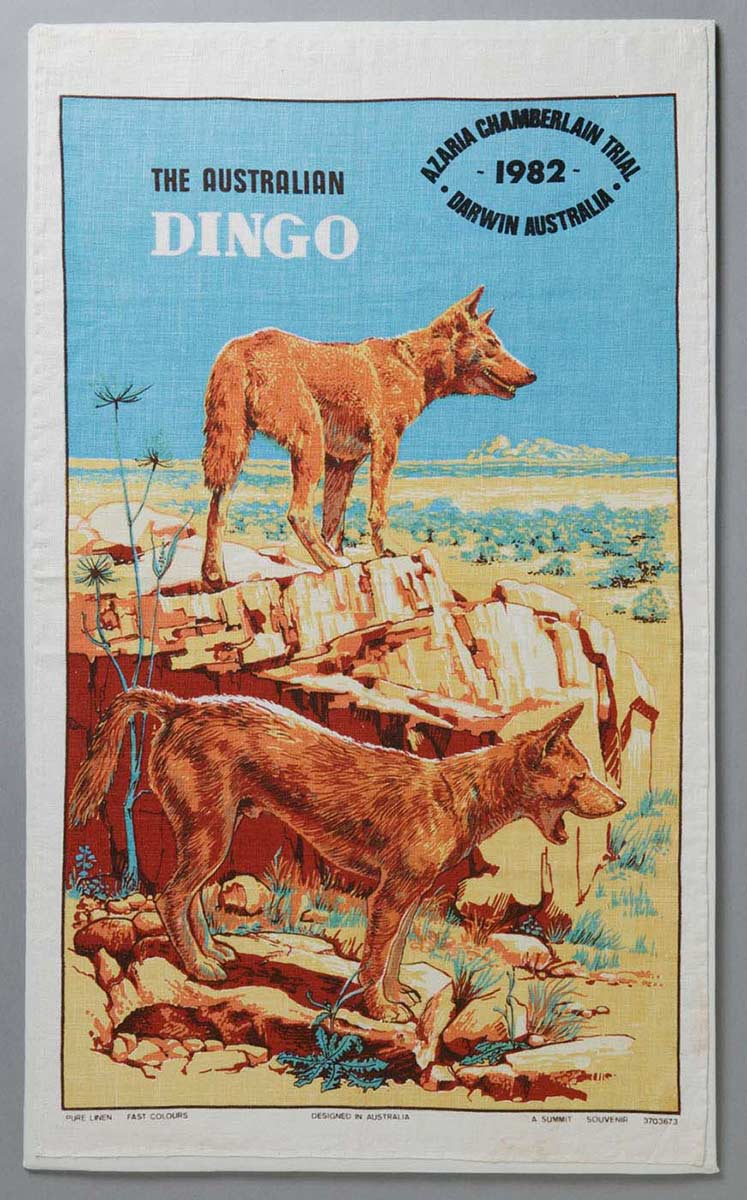Tea towel showing two dingoes near Uluru, with text 'The Australian Dingo, Azaria Chamberlain Trial, Darwin Australia, 1982. - click to view larger image