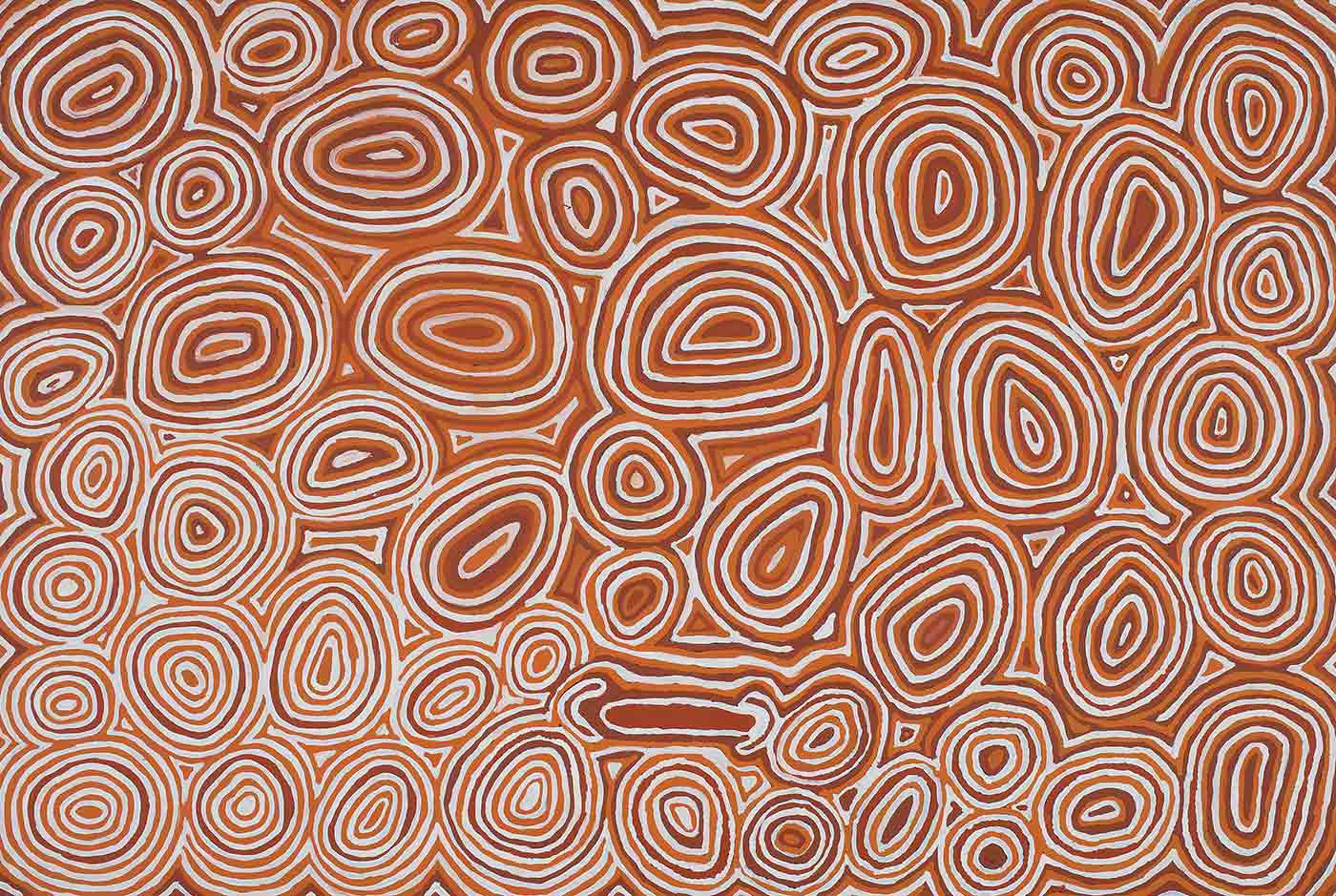 A painting on brown linen covered in concentric ovals and circles in white, light brown and dark brown with spaces between filled in the same colours. In the centre is a concentric circle with a flat bottom edge, and towards the bottom centre edge is a brown horizontal line with a C shape wrapped around each end. In the lower left corner the circles have wider white rings giving the appearance of a lighter area of ground.