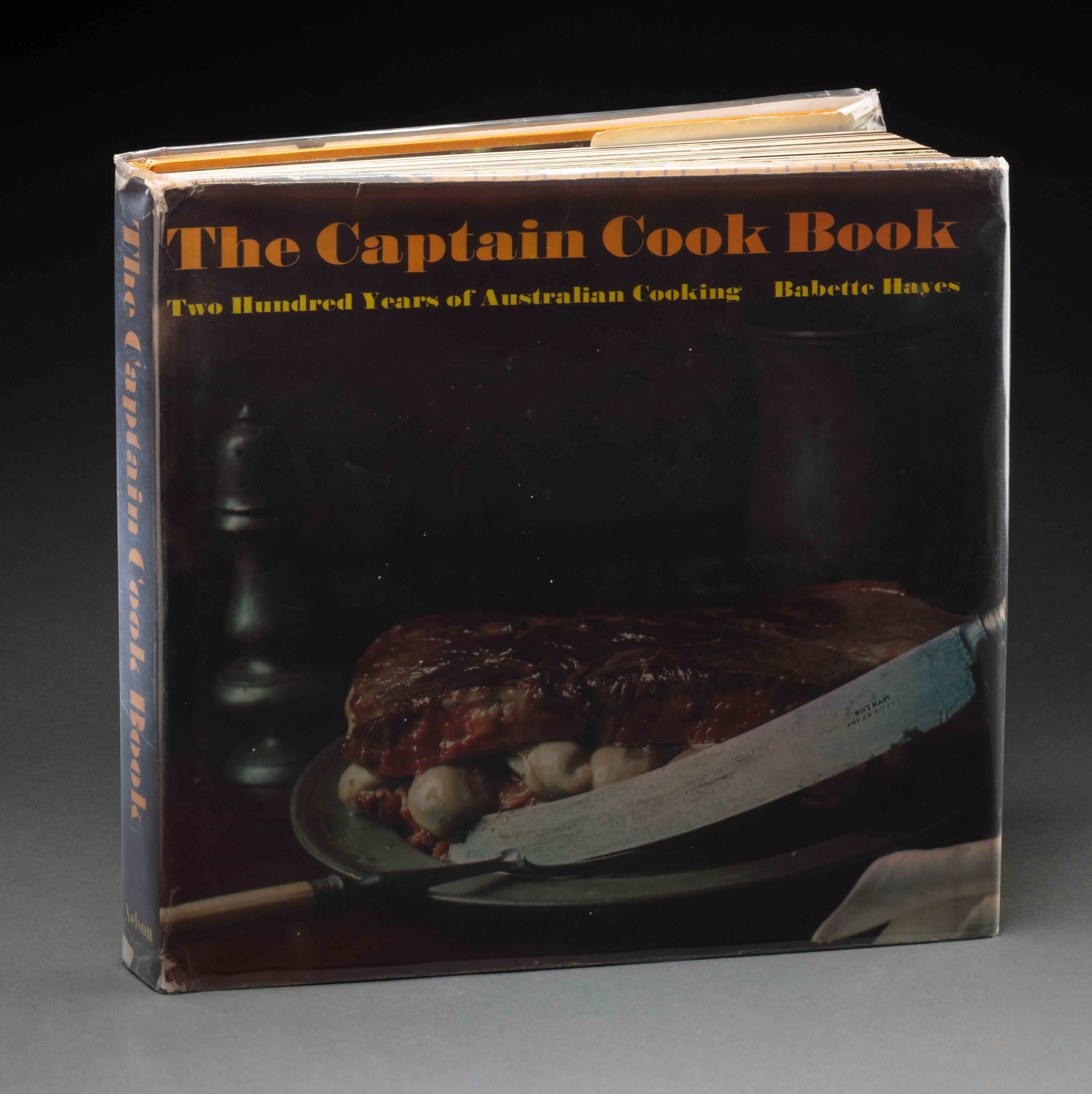 200 Years of Australian Cooking: The Captain Cook Book 1970 featuring an image of a large knife and oysters sandwiched between two thick slices of meat on the cover. - click to view larger image