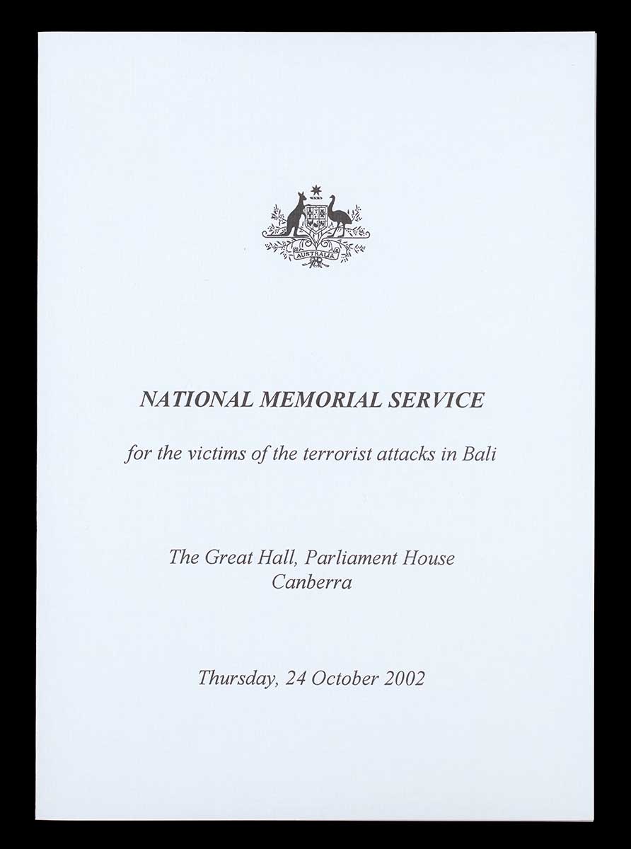 A4 white paper printed with text 'National Memorial Service / for the Victims of the Terrorist Attacks in Bali / The Great Hall Parliament House / Canberra / Thursday, 24 October 2002)'. - click to view larger image