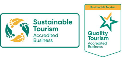 Images of two logos for tourism sustainability. 