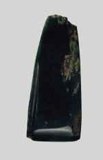 Adze blade made of dark-coloured greenstone.