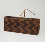 Basket made of ‘alu (a native creeper with tendrils) and coconut fibres, with a rectangular opening in a dark brown colour.