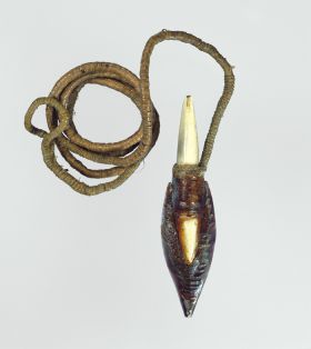 A harpoon point made of a concave piece of mussel shell, cemented between two pieces of pointed bone, with thick, twisted cord affixed to the underneath of the shell tip.