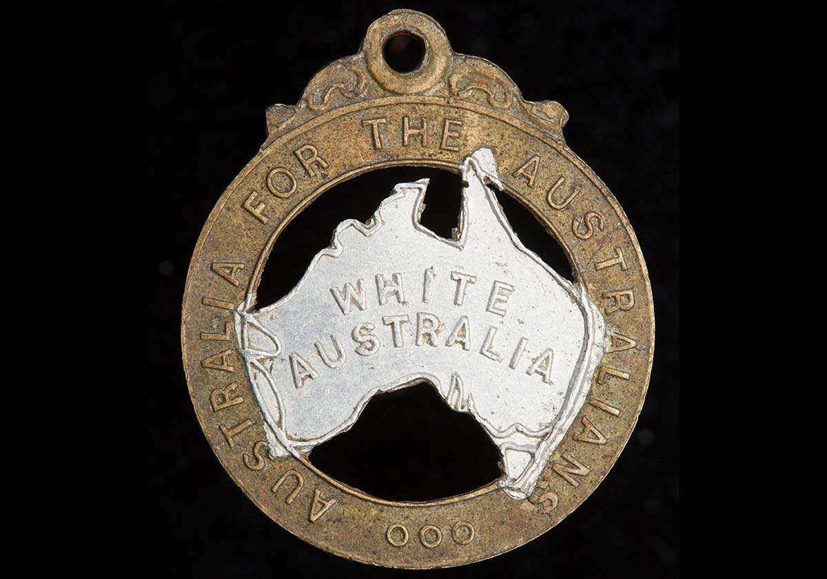 This 28mm-high badge has the words ‘Australia for the Australians’ stamped on the rim and the words ‘White Australia’ stamped on silver-painted representation of the Australian continent in the middle.
