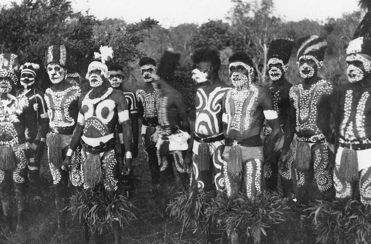 Ceremonial dancers decorated with paint and traditional costume, 1955. - click to view larger image