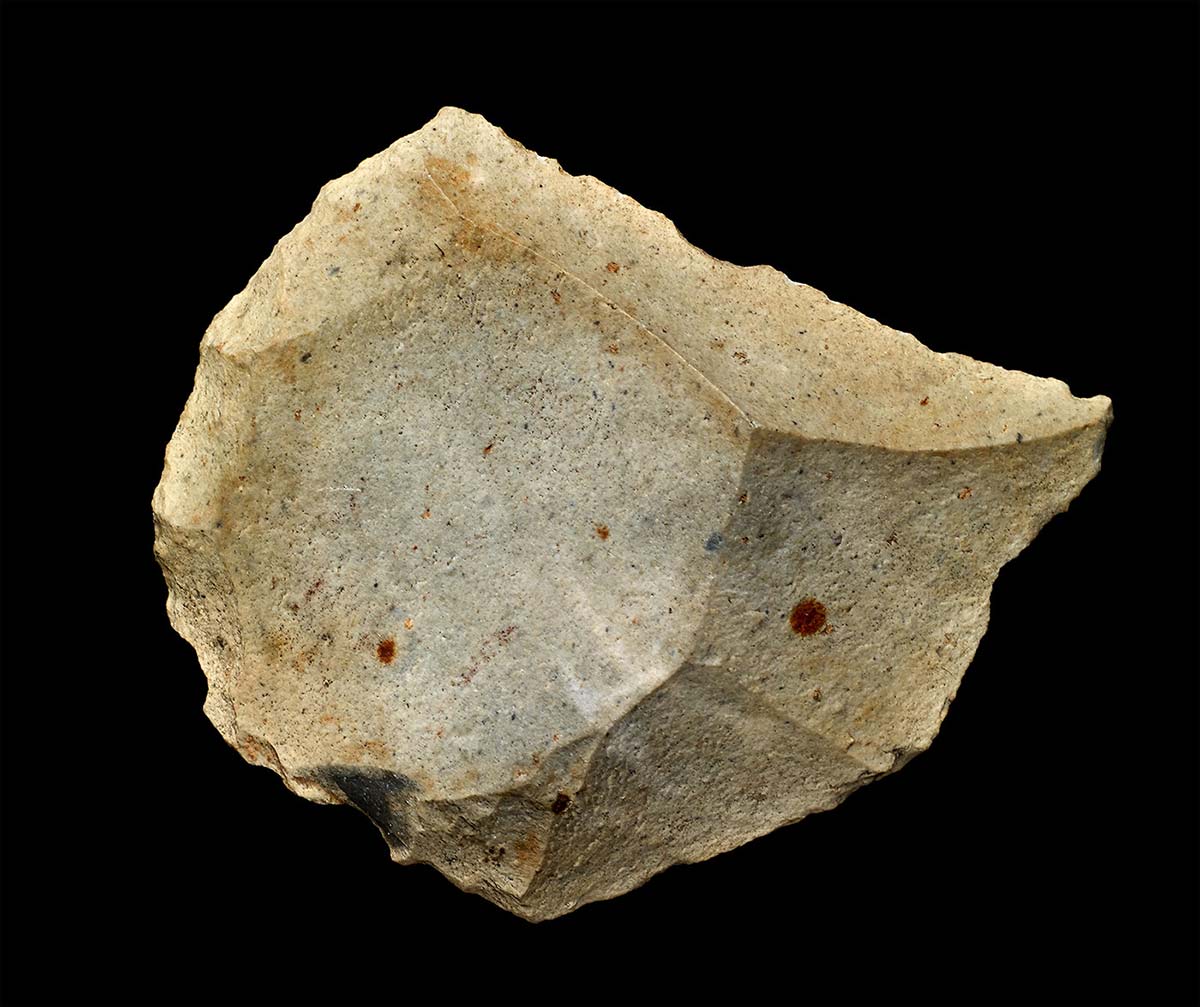 Light coloured stone with rigid edges and a rough surface. - click to view larger image
