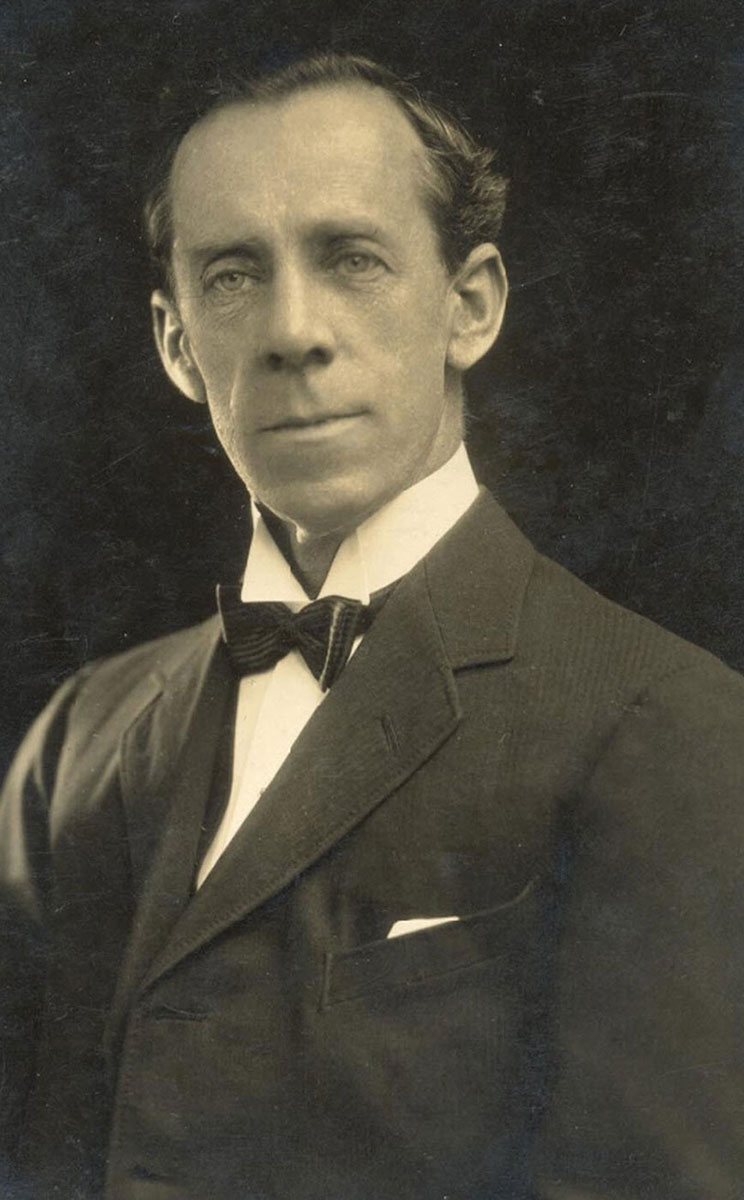 Sepia-toned photograph of white male wearing early twentieth century clothing. - click to view larger image