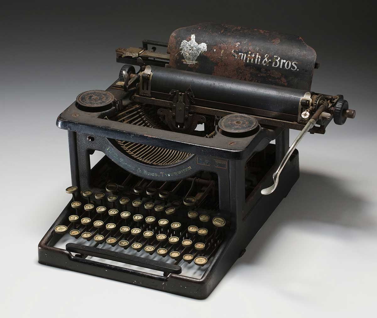Antique typewriter with faded logo of L.C. Smith & Brothers. - click to view larger image