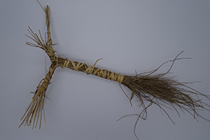 A bunch of straight twigs wrapped with twine.