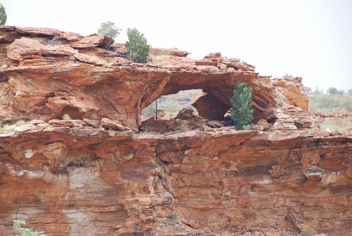 Colour image of a rock with an arch formation.