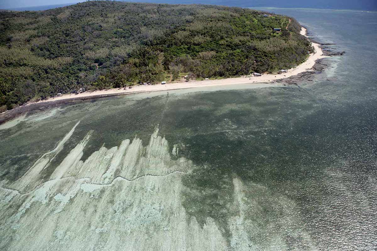 A colour photo of a section of the coastline around Mer (Murray Island), Torres Strait.