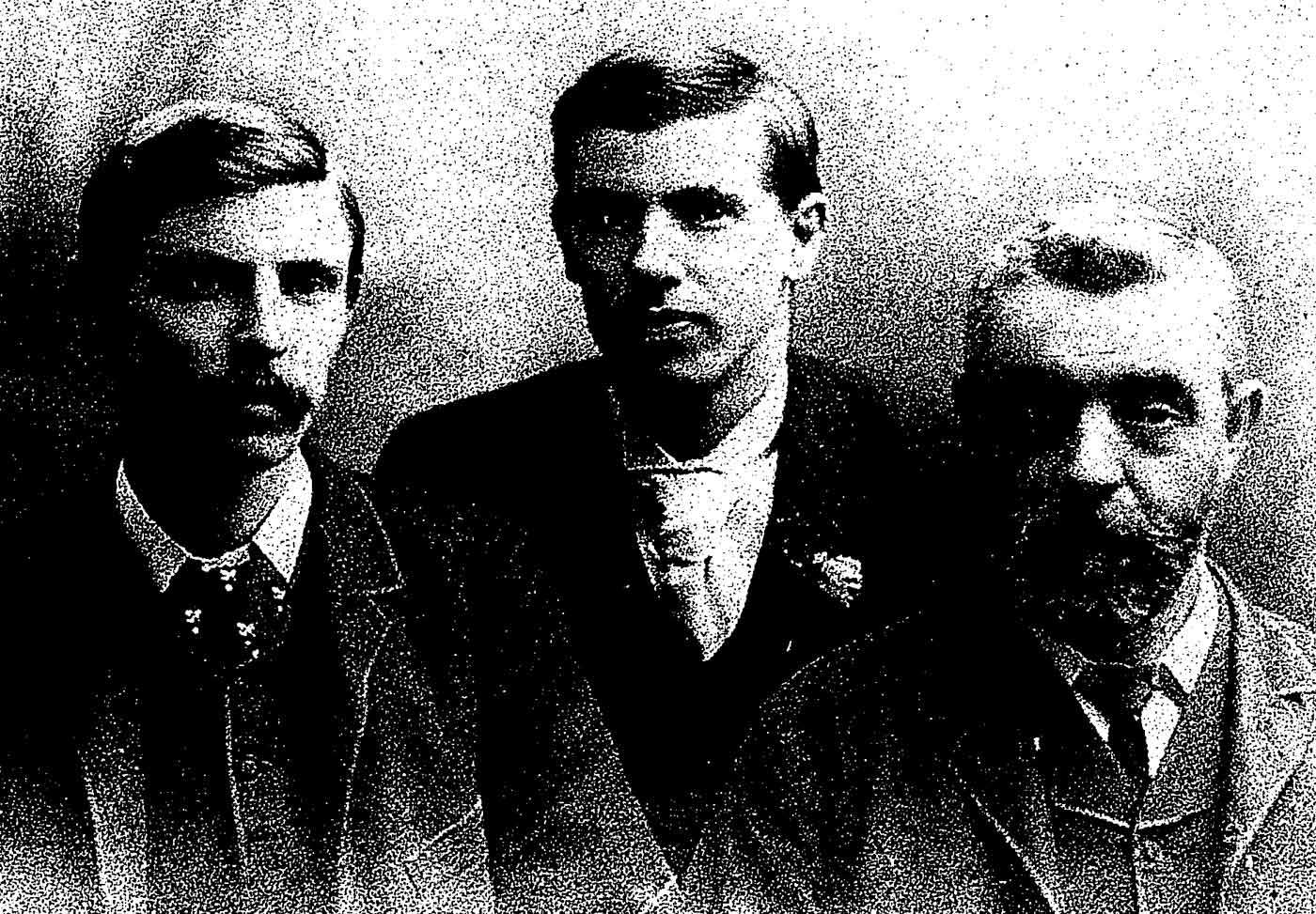 Black and white photo portrait of an older man and two younger man. - click to view larger image