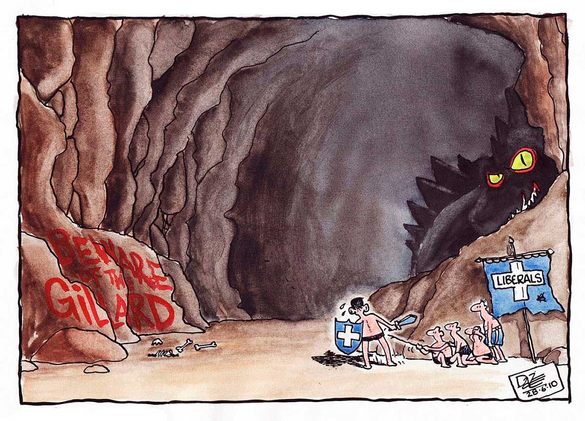 A colour cartoon depicting the entrance to a large cave. At left of the entrance, written on a rockface, is 'Beware the Gillard'. At right of the entrance is a small group of men, wearing only shorts. They have a tattered banner that says 'Liberals'. One of them carries a sword and a shield, and is being forced into the cave by the other men. He looks most reluctant. In the shadows of the cave can be seen a massive dragon-like monster, with a spiny back and large yellow menacing eyes. - click to view larger image