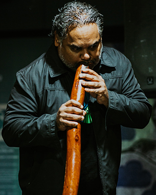 A portrait photo of Ben Ferguson, Aboriginal Cultural Programs Coordinator at Saltwater Freshwater Arts Alliance.