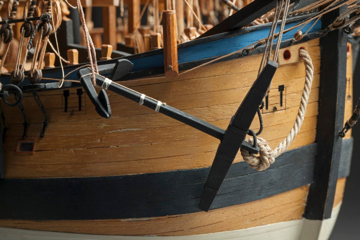 Detail image showing an an anchor at the side of a ship.  - click to view larger image