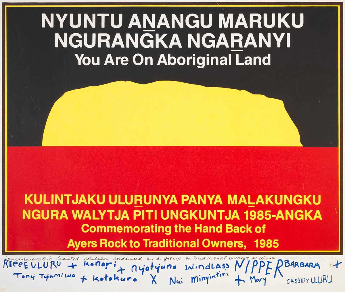 A limited first edition print poster similar in design to the black over red Aboriginal flag, but the sun in the centre has been replaced by a yellow silhouette of Uluru (Ayers Rock). 