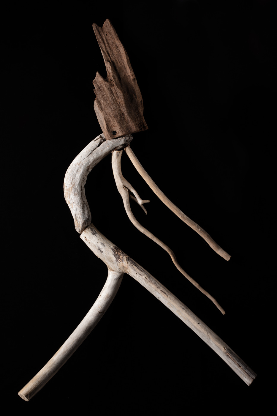 A figurative artwork made from driftwood, galvanised screws and copper wire. - click to view larger image