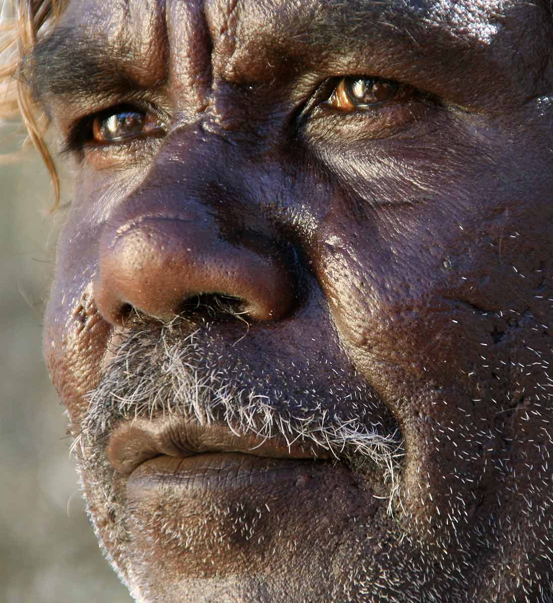 Portrait of Richard Yukenbarri (Yugumbari) Tjakamarra. - click to view larger image