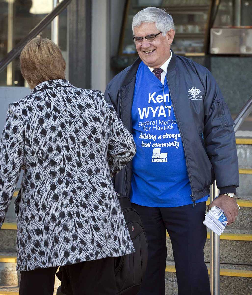 Member of Parliament Ken Wyatt greets a woman during his election campaign.