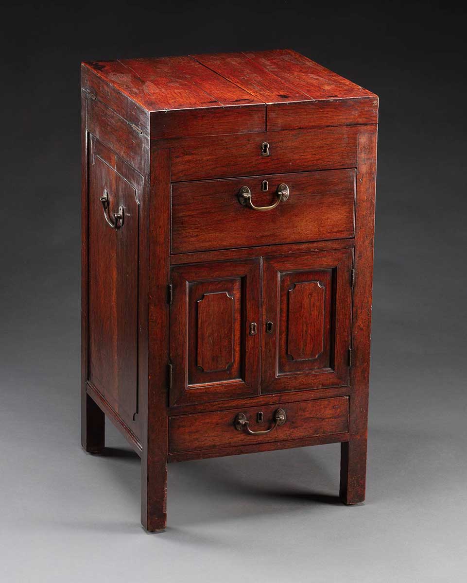 Detail of a wooden dresser table with multiple compartments. - click to view larger image