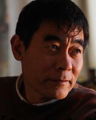 Portrait photo of Zhou Xiaoping.