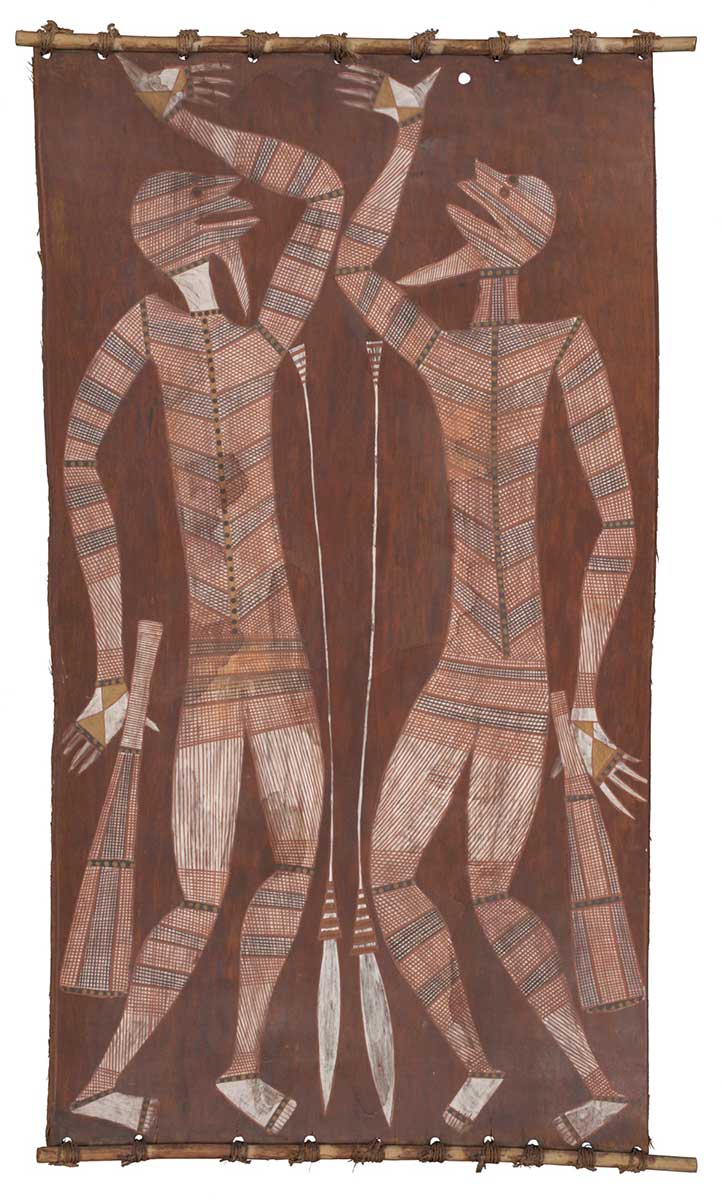 A bark painting worked with ochres on bark and on wooden restrainers. It depicts two male figures, each with a spear and a woomera. The figures are painted in white with crosshatching, stripes and spots in black, brown and yellow. The painting has a brown background. - click to view larger image