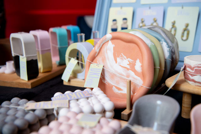 Detail image showing various resin and ceramic jewellery and small homewares. - click to view larger image