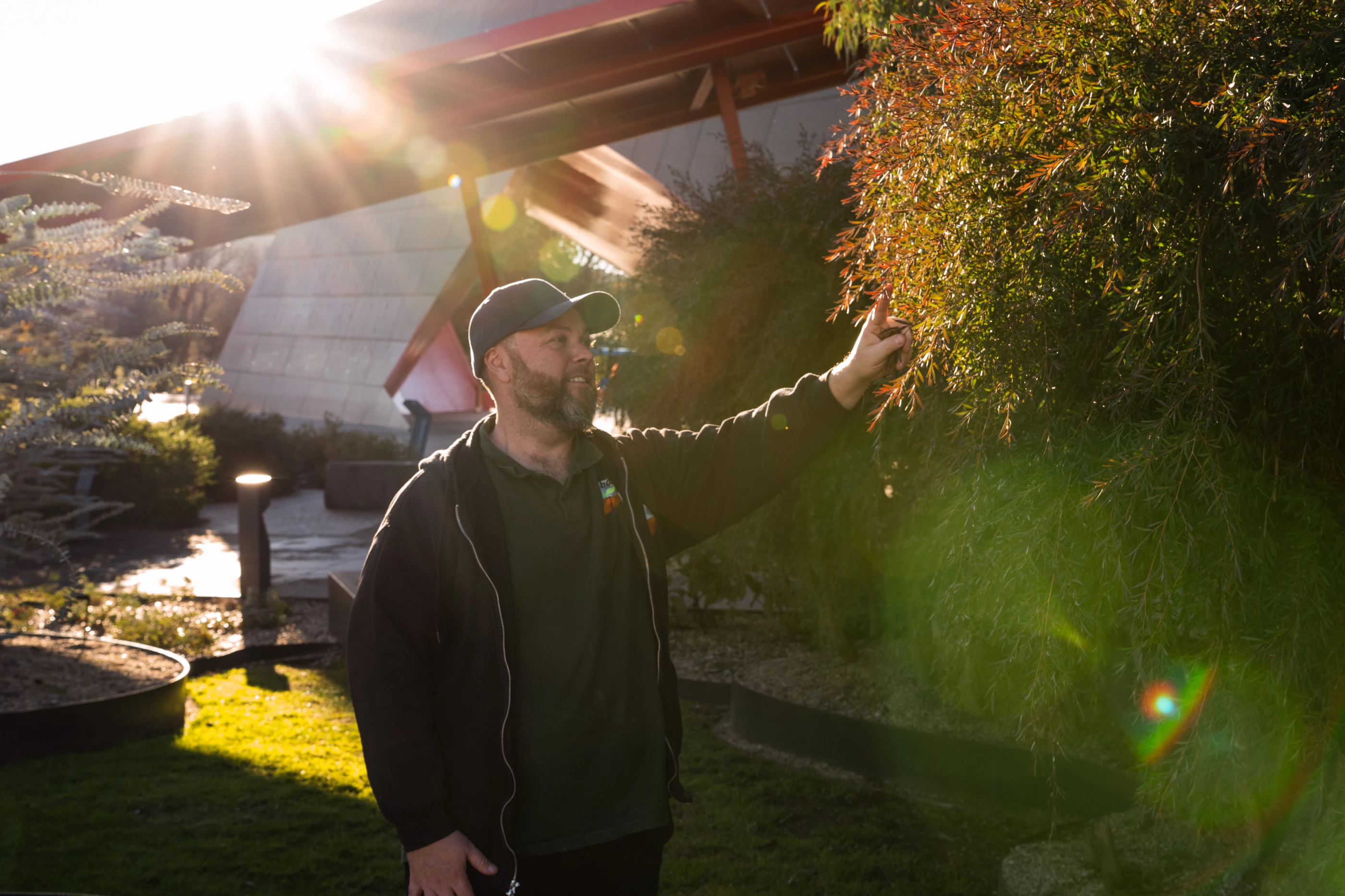 Photo of Adam Shipp with tree at the Museum.