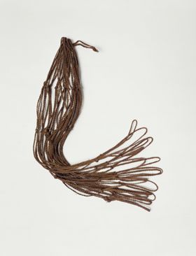 Brown netted bag with large holes made from a plant material.