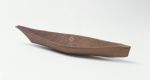 Model of a canoe made of wood with a beak like bow and steeply raised stem, replicating the Nootka dugout canoes that were thirteen metres long.